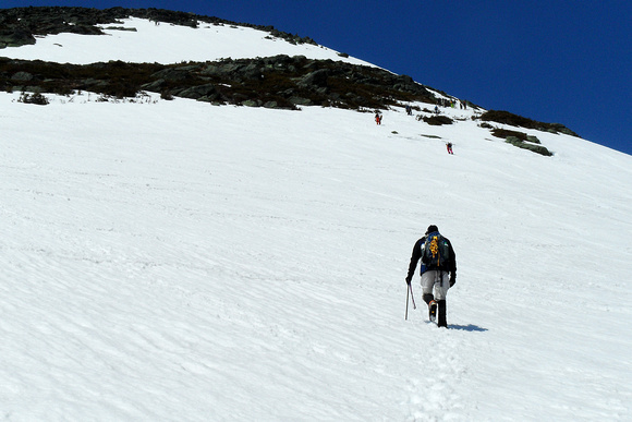 Jim Moves Up Steepening Snowfield Above Alpine Garden