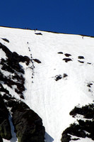 Skiers Working Up Headwall in Hopes of Glorious Descent