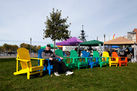 Dad Catches a Break on One of the Colorful Adirondack Chairs at Inner Harbor